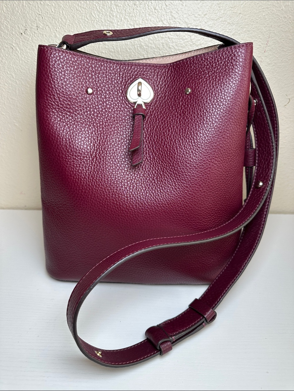 Like NEW KATE SPADE Pebbled Leather Bucket Bag in Burgundy